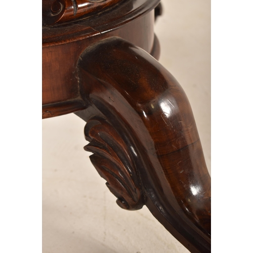 606 - A 19th century Victorian rosewood centre table / breakfast loo table. The table having a rounded top... 