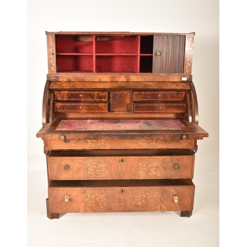 607 - A 19th century Dutch marquetery inlaid cylinder bureau desk. The bureau having tambour fronted cupbo... 