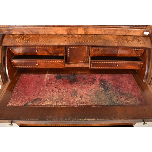 607 - A 19th century Dutch marquetery inlaid cylinder bureau desk. The bureau having tambour fronted cupbo... 