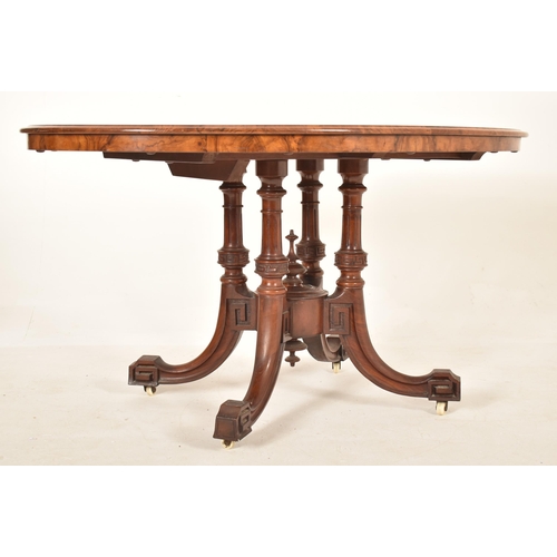 608 - A 19th century High Victorian walnut oval tilt top loo / breakfast table. The table being raised on ... 