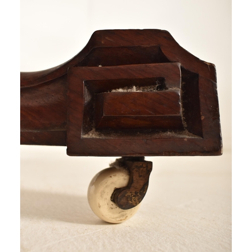 608 - A 19th century High Victorian walnut oval tilt top loo / breakfast table. The table being raised on ... 