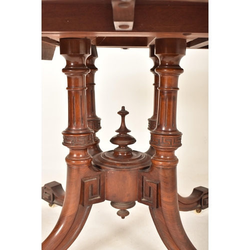 608 - A 19th century High Victorian walnut oval tilt top loo / breakfast table. The table being raised on ... 