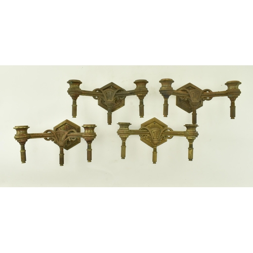 612 - Two pairs of 19th century Neoclassical gilt metal wall sconces. Each having twin arms with architect... 