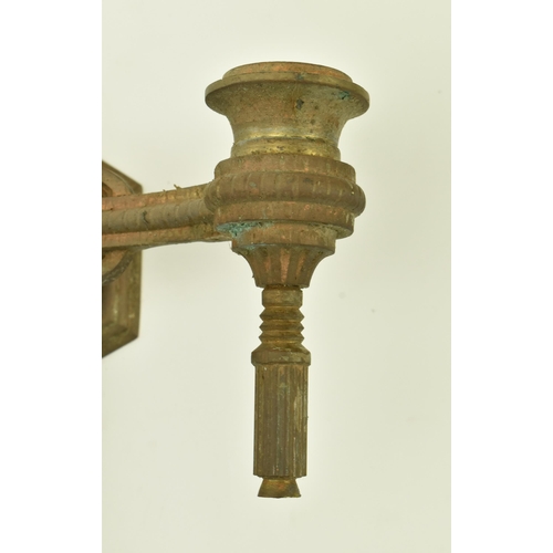 612 - Two pairs of 19th century Neoclassical gilt metal wall sconces. Each having twin arms with architect... 