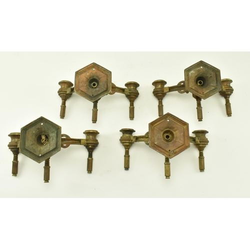 612 - Two pairs of 19th century Neoclassical gilt metal wall sconces. Each having twin arms with architect... 