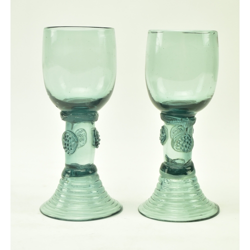 66 - A pair of late 18th century continental roemer drinking glass. Each glass having a bucket bowl above... 