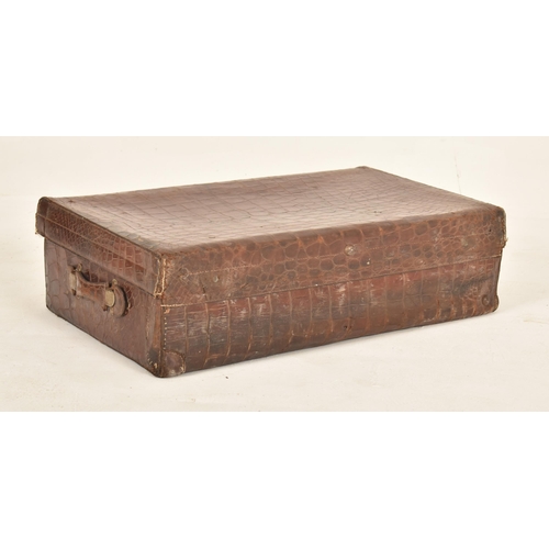 402 - A large early 20th century crocodile skin leather suitcase / travel case. The case with metal locks ... 