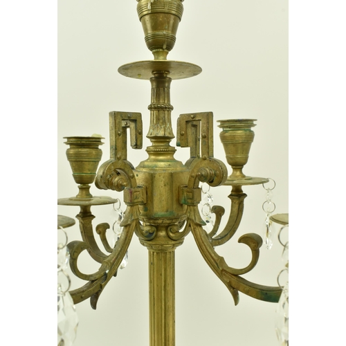 416 - A pair of French inspired early 20th century brass desk table candelabras. Each candlestick having a... 