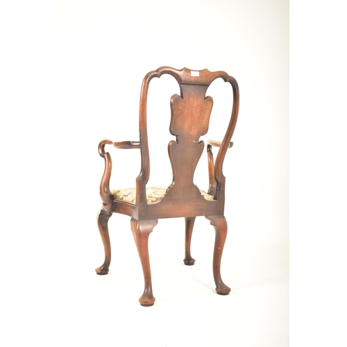 426 - A Queen Anne style 19th century carved walnut armchair. The chair having a pierced back rest with sh... 