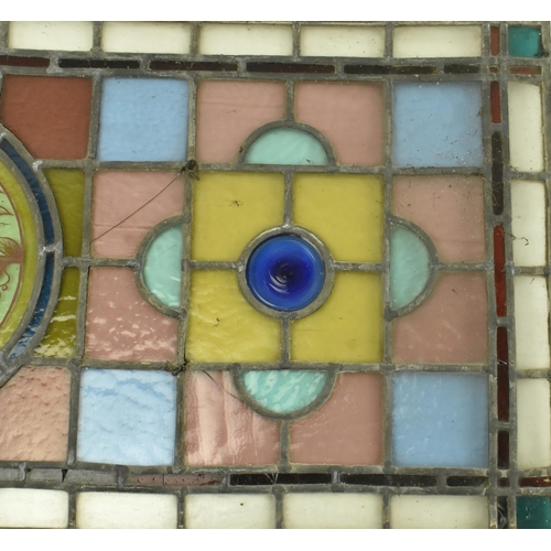 428 - A 19th century Victorian stained glass window feature panel, brightly coloured. The stained glass fr... 