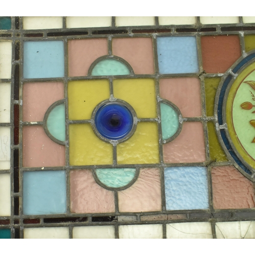 428 - A 19th century Victorian stained glass window feature panel, brightly coloured. The stained glass fr... 