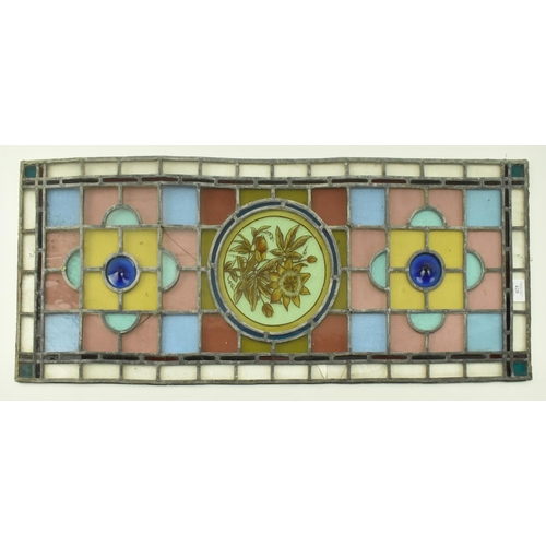 428 - A 19th century Victorian stained glass window feature panel, brightly coloured. The stained glass fr... 