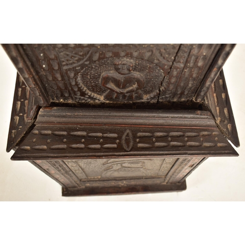 435 - A Dutch Flemish 19th century ebonised carved oak 8-day movement longcase clock. The clock having bra... 