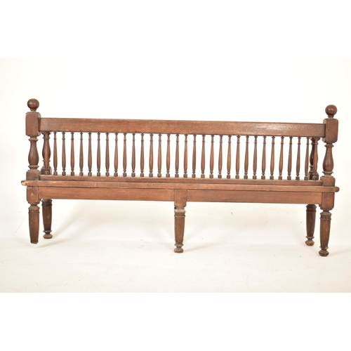 438 - A Victorian 19th century oak wood spindle back hall settle bench. The bench having block & turned ba... 