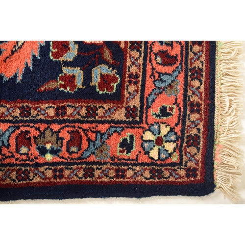 444 - A 20th century 1950s Lilihan Persian floor carpet rug runner. The runner having a cobalt blue ground... 