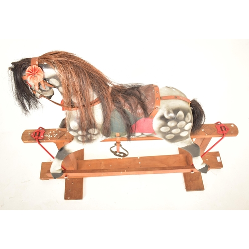 451 - An early 20th century circa 1920s hand painted rocking horse in the manner of Line Bros. The horse w... 