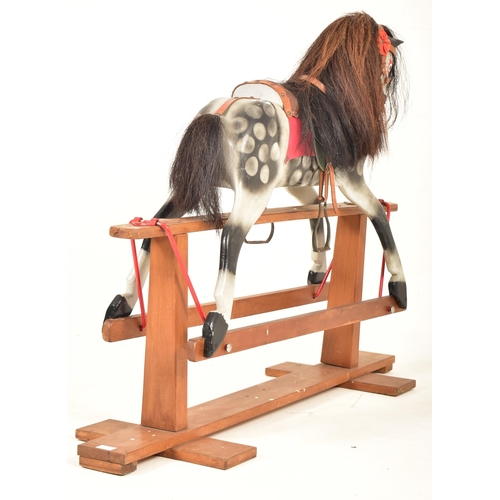 451 - An early 20th century circa 1920s hand painted rocking horse in the manner of Line Bros. The horse w... 