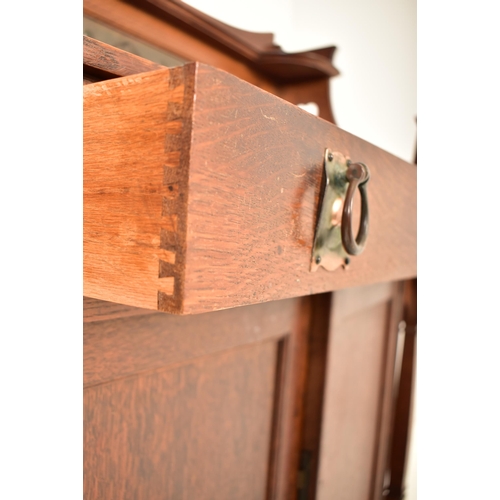 456 - Manner of Shapland & Petter - An Arts & Crafts late 19th century oak & embossed metal sideboard cred... 