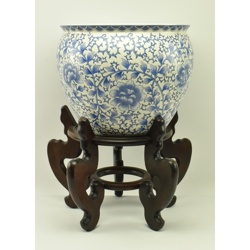 464 - A large Chinese Oriental blue & white ceramic ' fish tank ' planter jardiniere bowl on wooden stand.... 