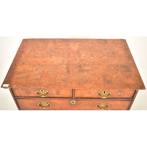 472 - An early 18th century Queen Anne burr walnut chest of drawers. The chest of drawers featuring two sm... 