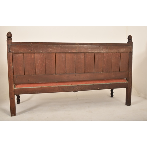 474 - A 19th century Victorian Gothic carved oak settle / bench. The settle having an intricately carved b... 