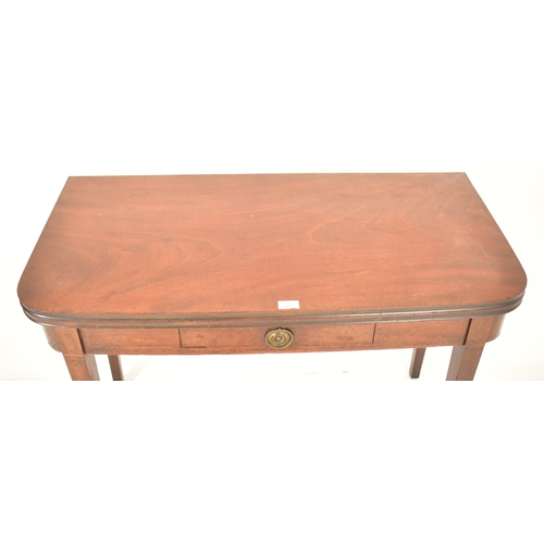 476 - A George III 19th century mahogany folding top tea table. The table having a straight folding top wi... 