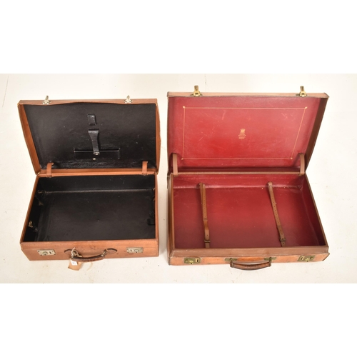 484 - A pair of vintage 20th century tan brown leather suitcases / travel case. Each case with metal / bra... 