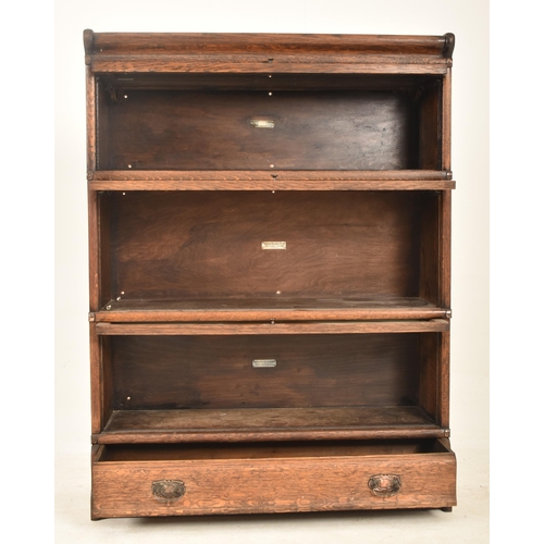 485 - Globe Wernicke - An early 20th century oak three section stacking lawyer's bookcase. The bookcase ha... 