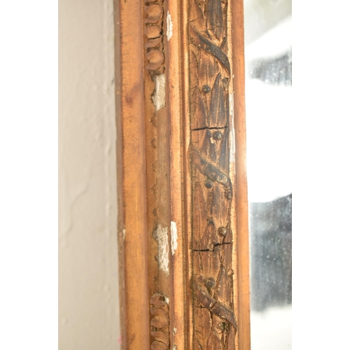 304 - A Victorian 19th century gilt gesso & wood wall mantel wall mirror. The mirror having a bowed top wi... 