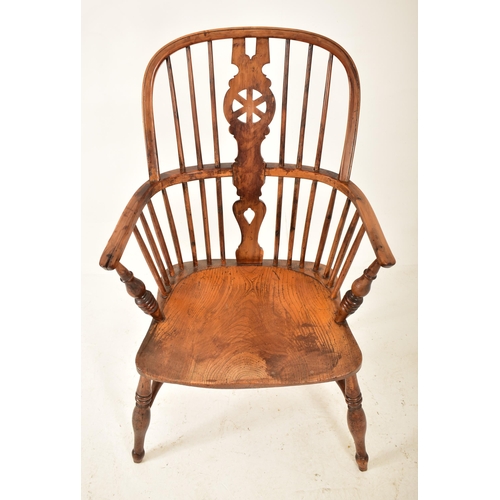 305 - A Victorian 19th century yew wood, elm & beech wood Windsor comb back armchair. The chair having a c... 