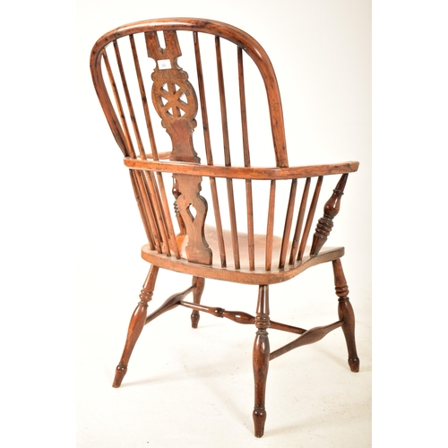 305 - A Victorian 19th century yew wood, elm & beech wood Windsor comb back armchair. The chair having a c... 