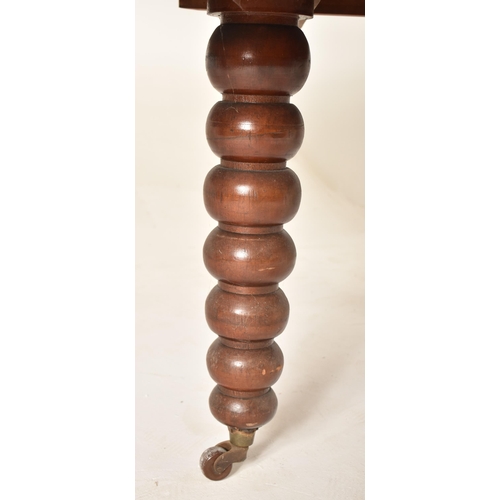 307 - A large Victorian 19th century mahogany bobbin leg round extending dining table. The table having a ... 