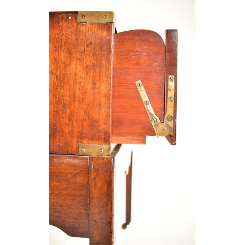 310 - A George III early 19th century mahogany campaign chest of drawers on stand. The chest having brass ... 