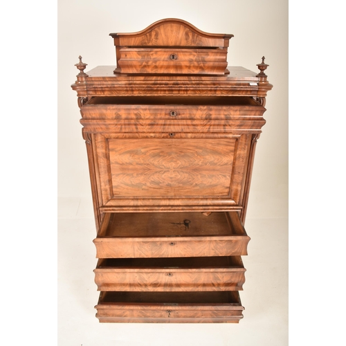 312 - A 19th century Biedermeier walnut secretaire bureau Abattant. The secretaire having a bowed top pedi... 