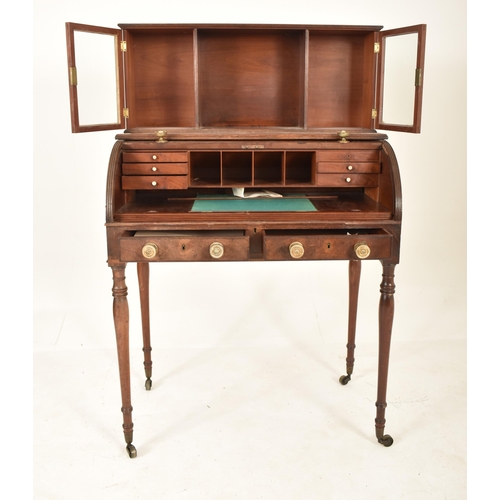 316 - A 19th century Victorian mahogany cylinder bureau desk. The bureau having a cabinet top with central... 