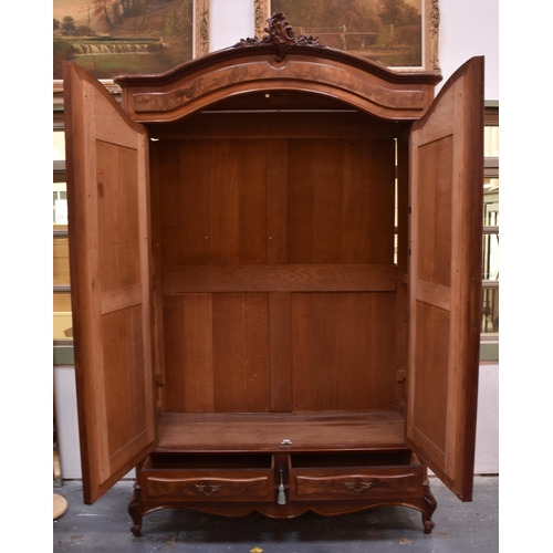 327 - A French 19th century Louis XV style fruitwood mirror front armoire wardrobe. The wardrobe having a ... 