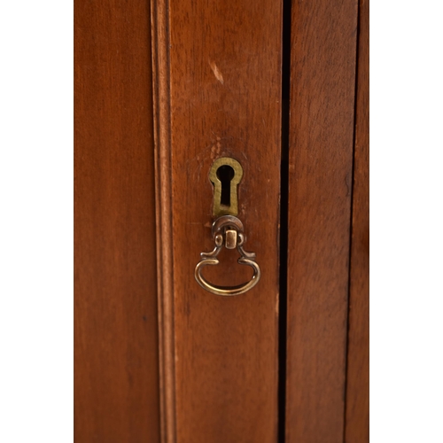 332 - An Edwardian mahogany astragal glazed library bookcase cabinet. The bookcase having a flyaway cornic... 