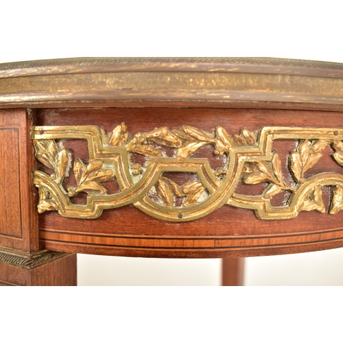 333 - A 19th century Biedermeier brass ormolu occasional circular low table. The table having a circular m... 