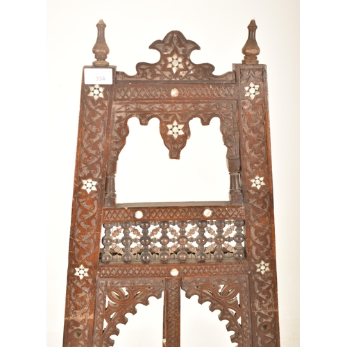 334 - A Moorish late 19th century carved hardwood & mother of pearl inlay artist's easel stand. The easel ... 