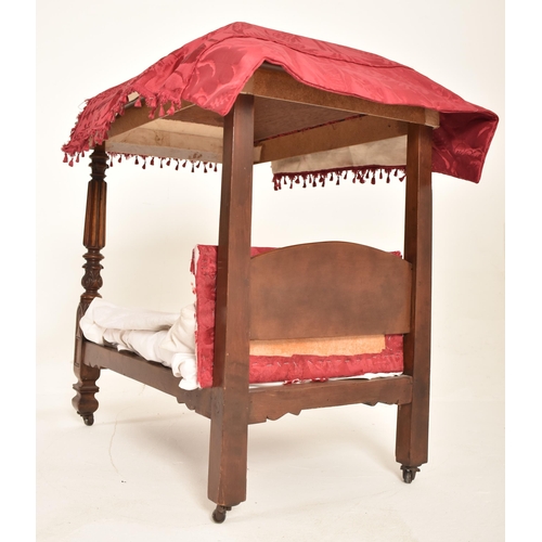 349 - A late 19th century Victorian apprentice mahogany four poster bed with furnishings. The bed with red... 