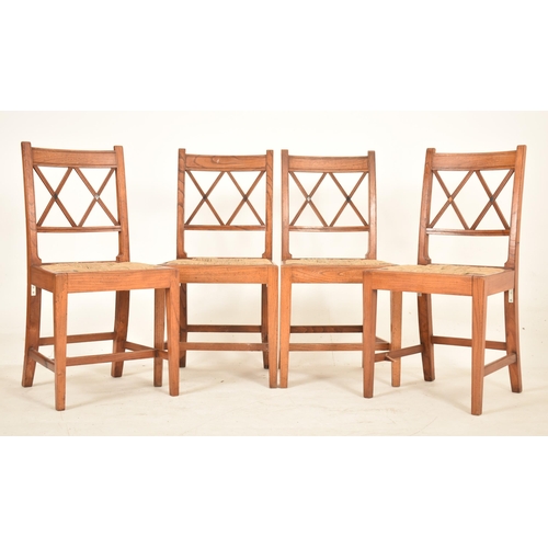 352 - A set of eight Regency early 19th century elm & rush seat dining chairs with carvers. Each chair hav... 