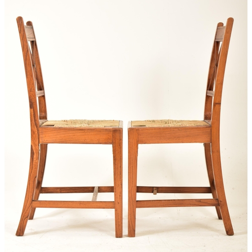 352 - A set of eight Regency early 19th century elm & rush seat dining chairs with carvers. Each chair hav... 