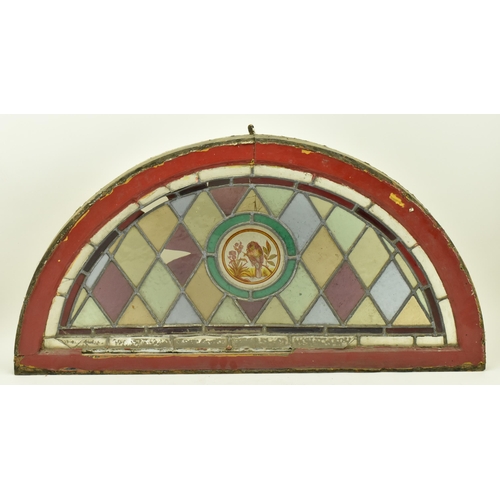 354 - A Victorian 19th century stained glass lead window panel in wooden frame. The panel of half moon for... 