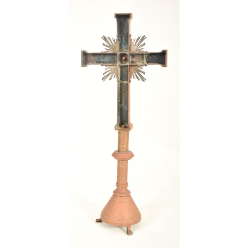 358 - A Baroque inspired patinated bronze reliquary altar floor crucifix cross. The crucifix having a flan... 