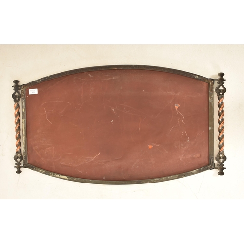 363 - An Arts & Crafts early 20th century copper framed wall hanging mirror. The mirror having barely twis... 