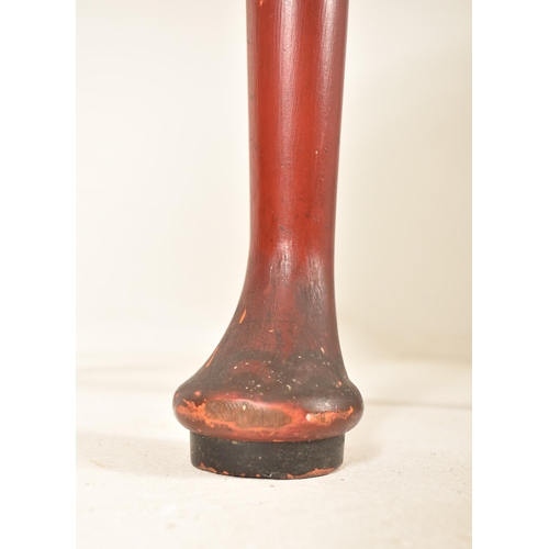 365 - A late 19th century Chinese red lacquered cabinet on stand. The cabinet top having a brass handle wi... 