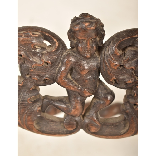 367 - A Carolean 17th century carved walnut & wicker hall chair. The chair having urn shaped finials atop ... 