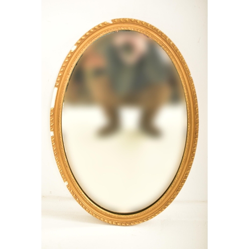 371 - A pair of late Victorian late 19th century gilt gesso & wood oval wall hanging mirrors. Each mirror ... 