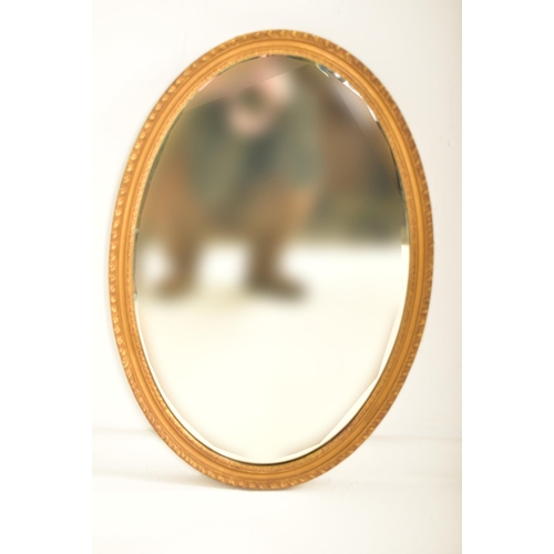 371 - A pair of late Victorian late 19th century gilt gesso & wood oval wall hanging mirrors. Each mirror ... 