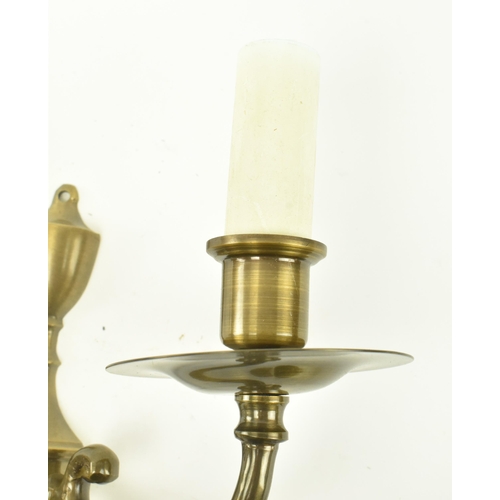 372 - A set of four Italian manner 20th century brass twin arm wall sconces lights. Each sconce having a c... 